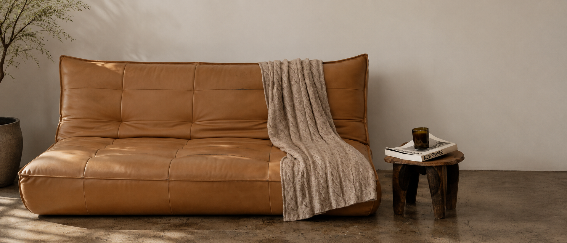 Decorative cushions styled across a warm and comfortable sofa